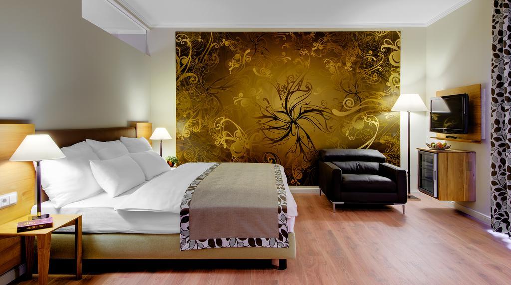 Deluxe Doppelzimmer mit Balkon zum Garten